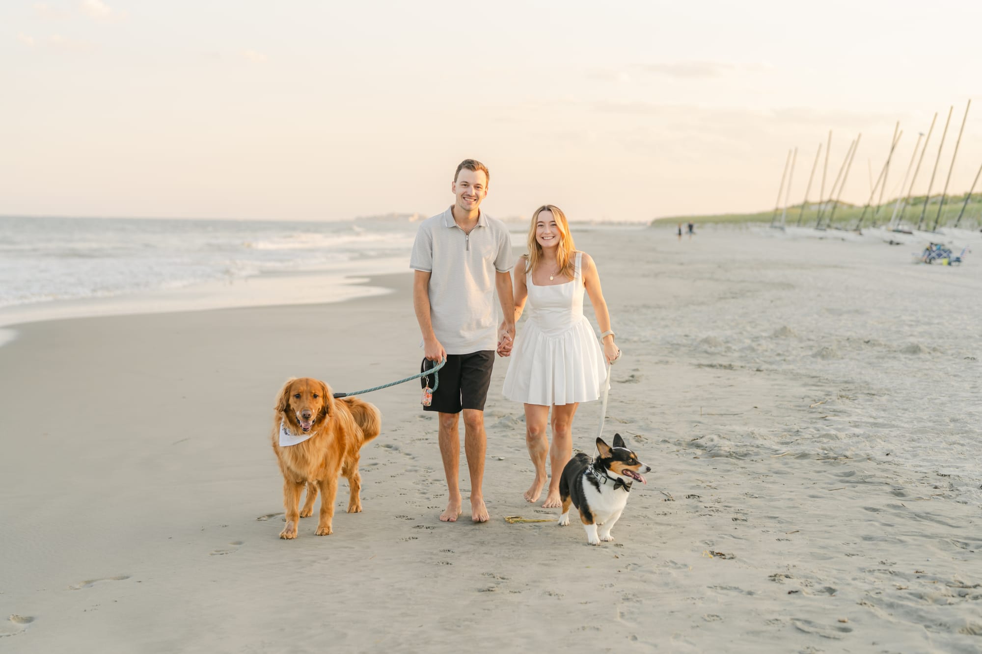 Walking the dogs along the shoreline at sunrise