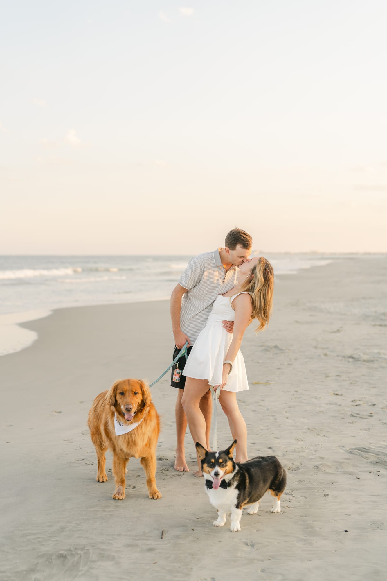 Standing on the beach with the golden retriever