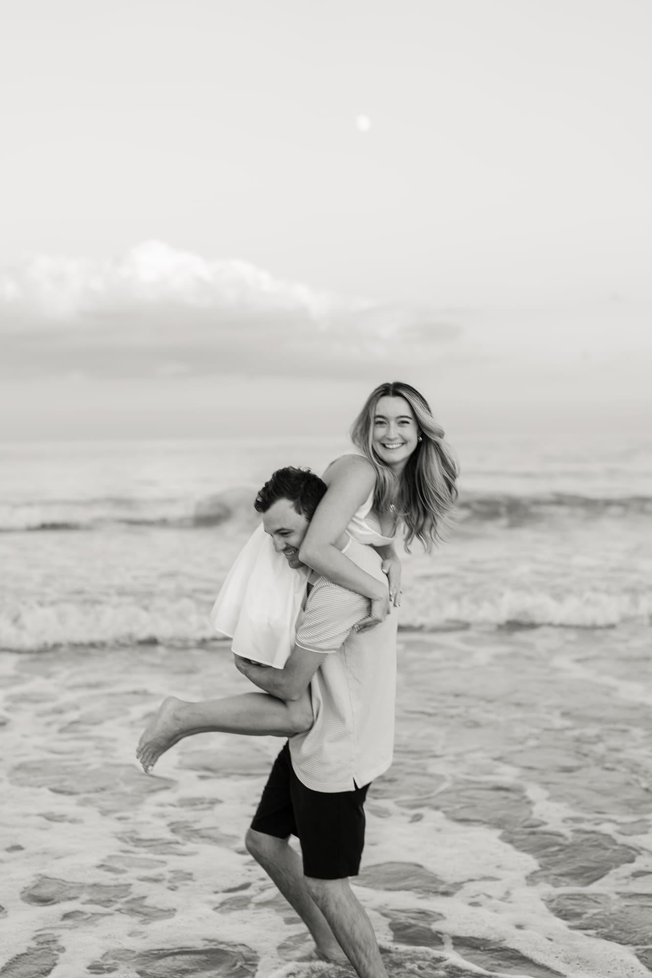 Piggyback ride along the water's edge
